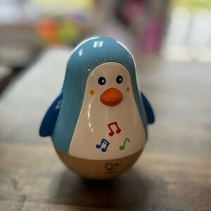 HAPE penguin musical wobbler